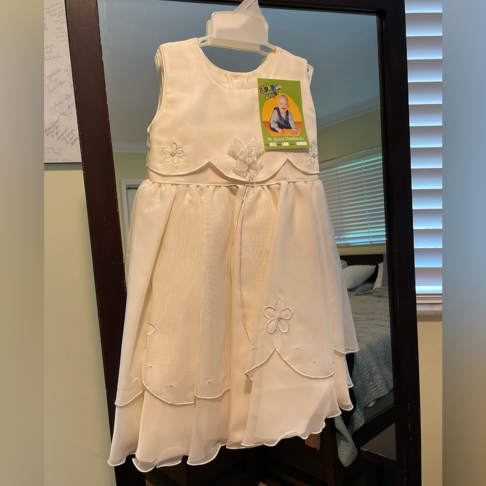 Kids dress.  Size 4.  Made in Colombia.  Never worn.